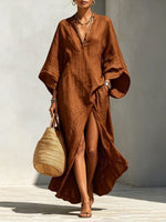 Vestido largo holgado de mujer con escote en V y mangas murciélago, ideal para vacaciones.
