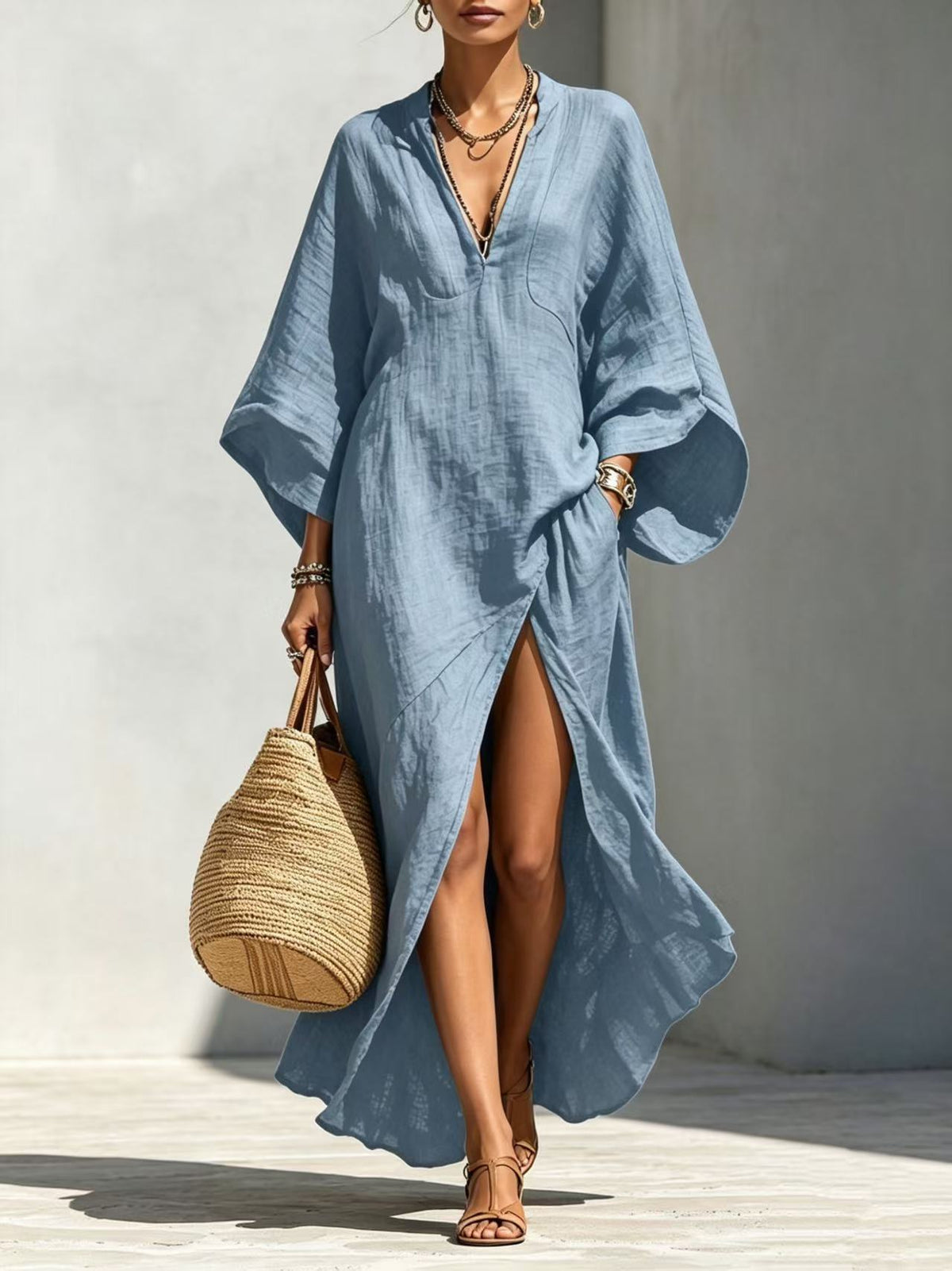 Vestido largo holgado de mujer con escote en V y mangas murciélago, ideal para vacaciones.