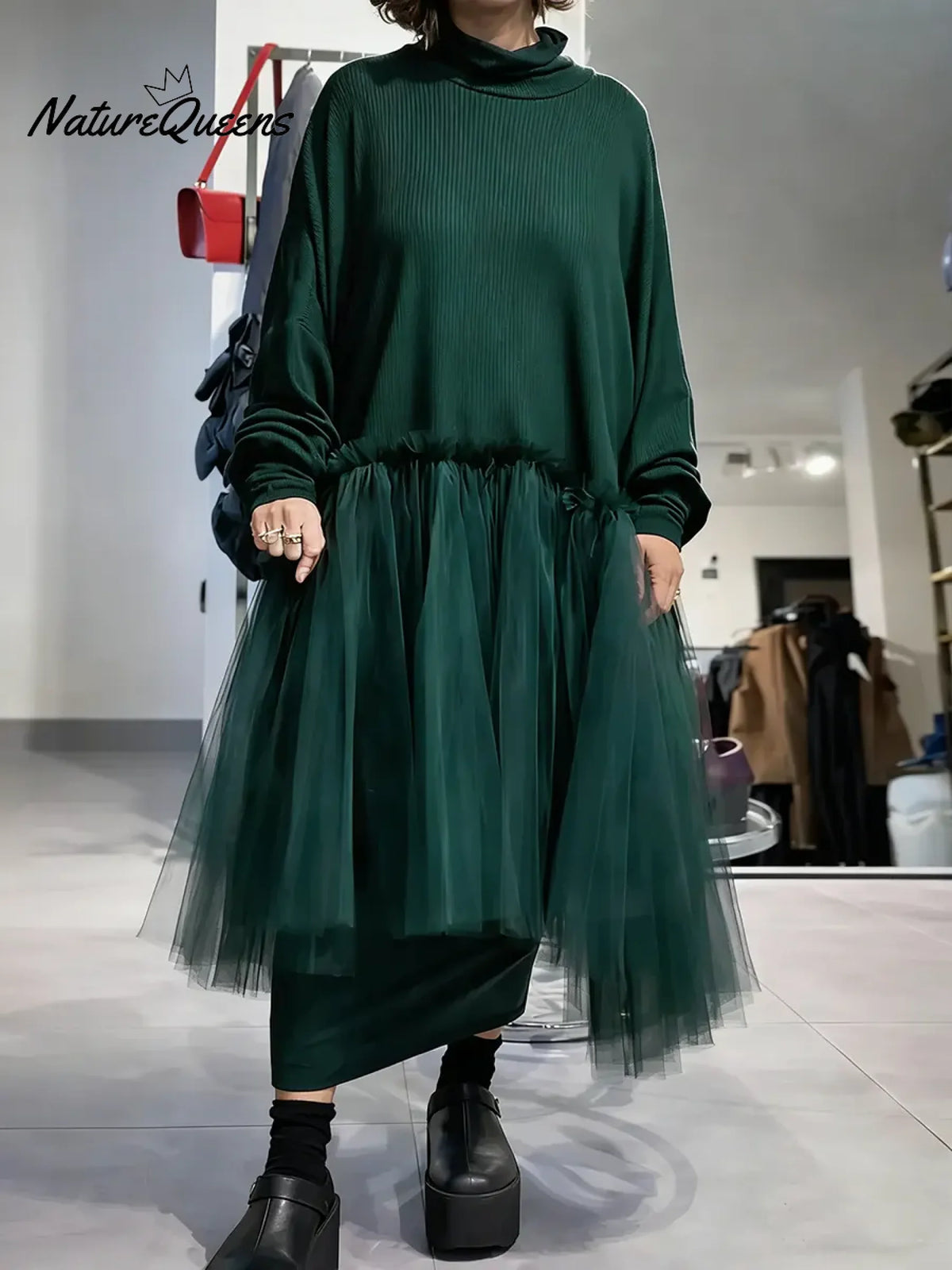 Women's solid color stand-collar long-sleeved casual loose-fitting knitted dress with mesh paneling.