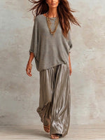 Two-piece Set Featuring A Relaxed-fit Knit Top And Glossy Trousers.