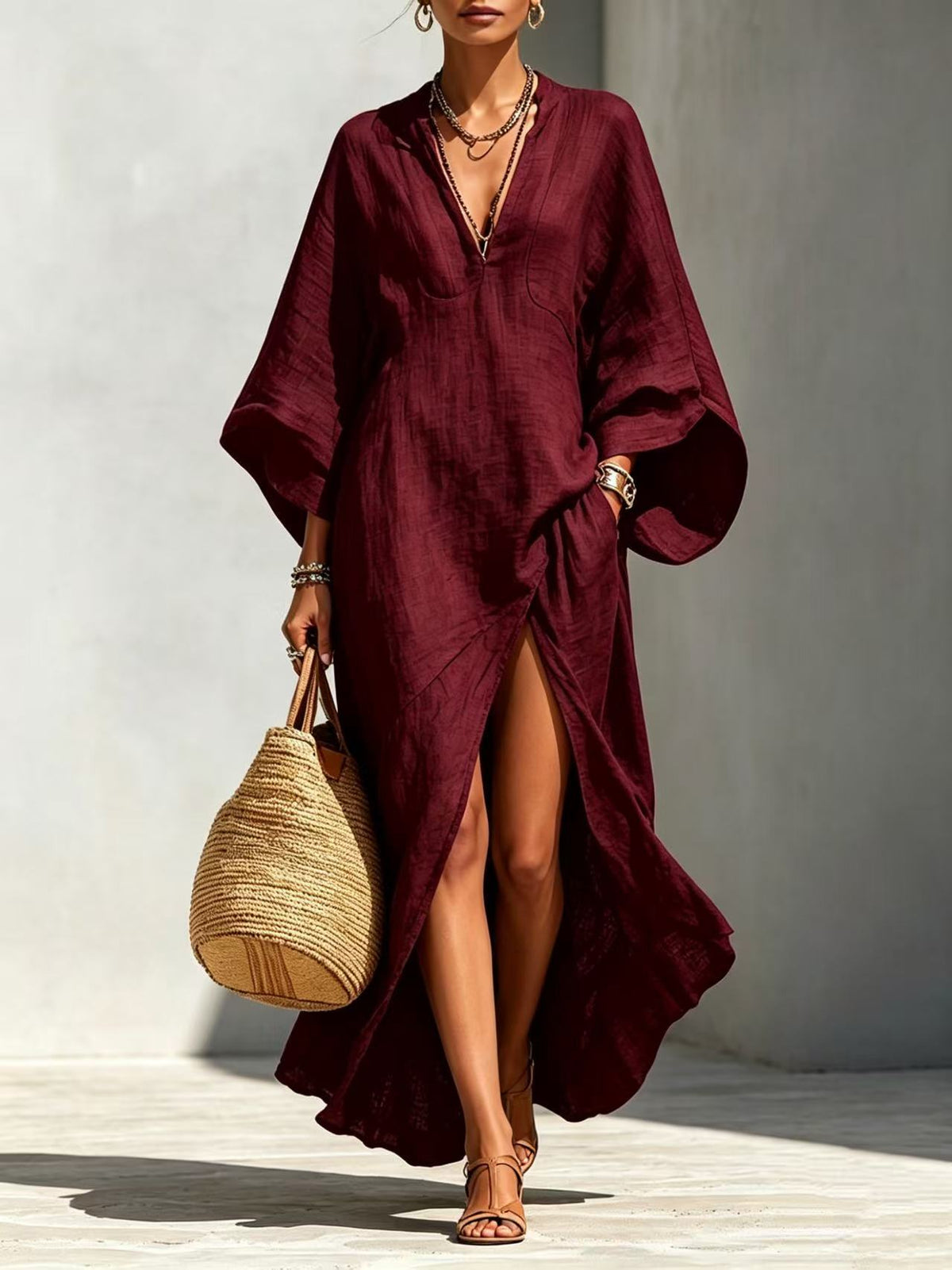 Vestido largo holgado de mujer con escote en V y mangas murciélago, ideal para vacaciones.
