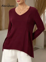 Women's Solid Color V-neck Long-sleeved Casual Loose-fitting Top With Irregular Hem.