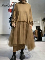 Women's solid color stand-collar long-sleeved casual loose-fitting knitted dress with mesh paneling.