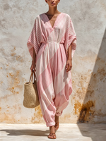 Vertical-striped V-neck Cotton Jumpsuit Featuring A Cinched Waist, Rolled Cuffs, And Loose-fitting Batwing Mid-length Sleeves.