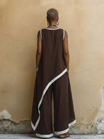 Conjunto minimalista de dos piezas para mujer con bloques de color, top y pantalón con bajo asimétrico.