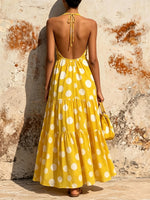Polka-dot Halter-neck Deep-v Maxi Dress With A Knotted Cutout And Tiered Ruffles.