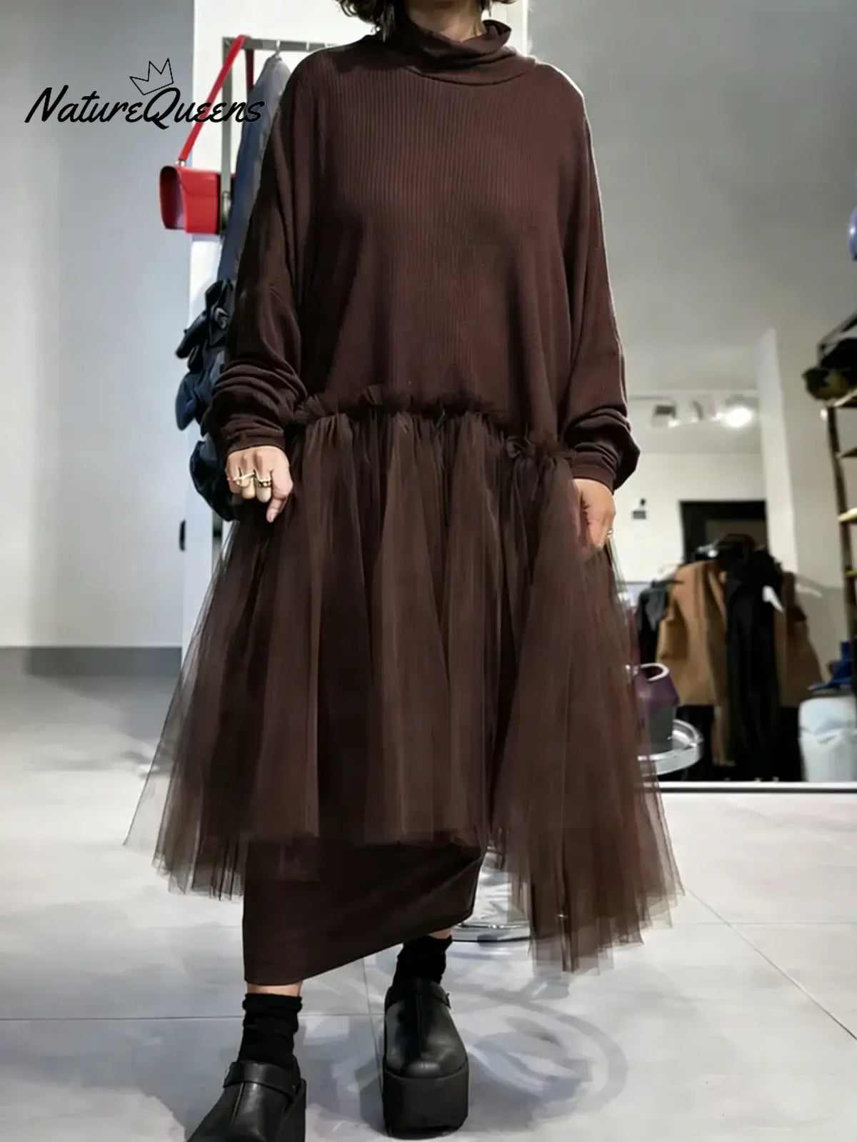 Women's solid color stand-collar long-sleeved casual loose-fitting knitted dress with mesh paneling.