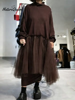 Women's solid color stand-collar long-sleeved casual loose-fitting knitted dress with mesh paneling.