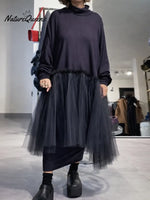 Women's solid color stand-collar long-sleeved casual loose-fitting knitted dress with mesh paneling.