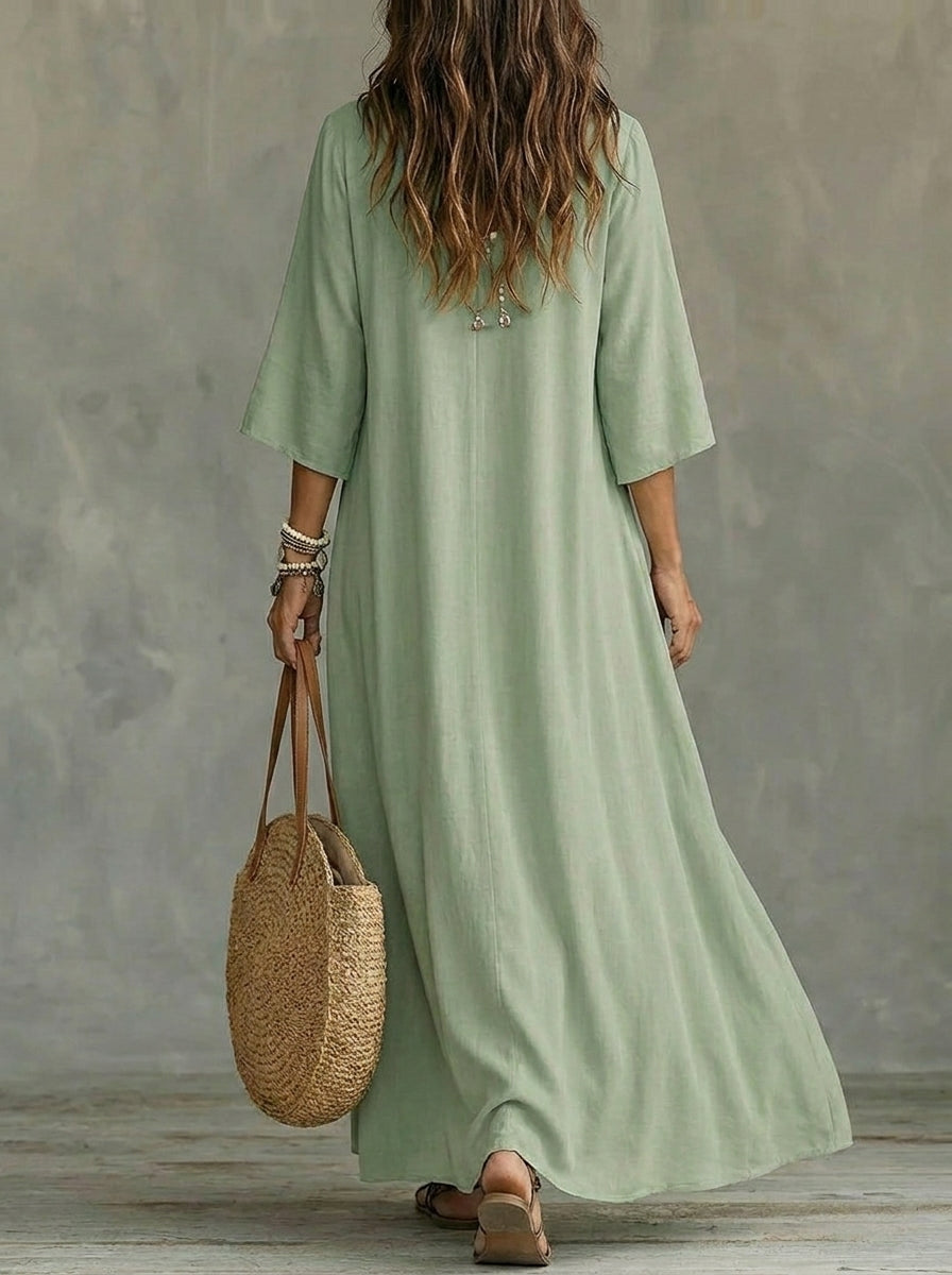 Vestido largo de mujer con mangas tres cuartos