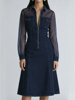 A Stylish Denim Dress With Mesh Sleeve Paneling.