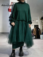 Women's solid color stand-collar long-sleeved casual loose-fitting knitted dress with mesh paneling.