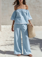 Cotton-linen Two-piece Set Featuring An Off-the-shoulder Top With Lettuce-edge Trim, Three-quarter Sleeves, And Striped Accents, Paired With Wide-leg Trousers Featuring Striped Cuffs.