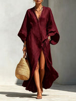 Vestido largo holgado de mujer con escote en V y mangas murciélago, ideal para vacaciones.