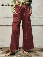 Women's Solid Color High-waisted Drawstring Wide-leg Pants Made Of Cotton And Linen Blend.