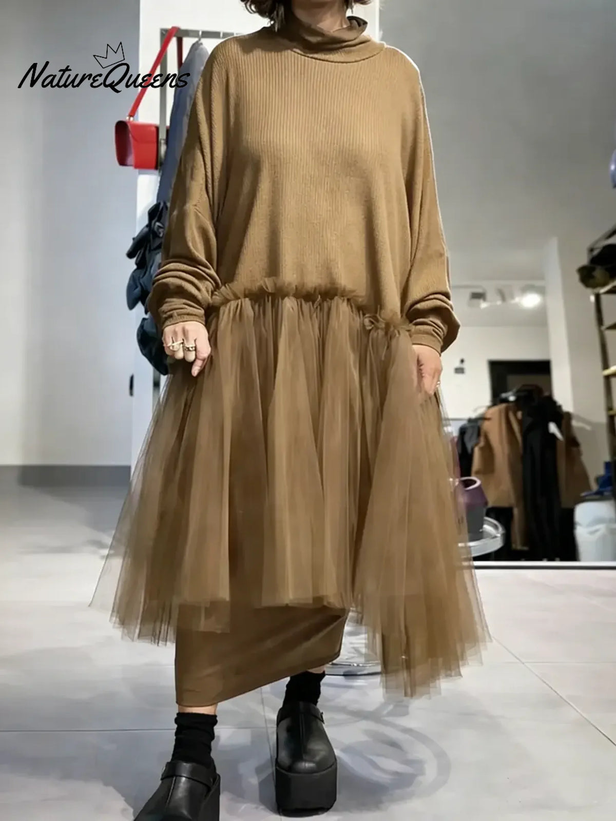 Women's solid color stand-collar long-sleeved casual loose-fitting knitted dress with mesh paneling.