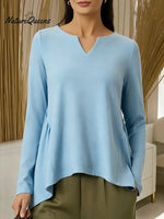 Women's Solid Color V-neck Long-sleeved Casual Loose-fitting Top With Irregular Hem.