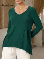 Women's Solid Color V-neck Long-sleeved Casual Loose-fitting Top With Irregular Hem.