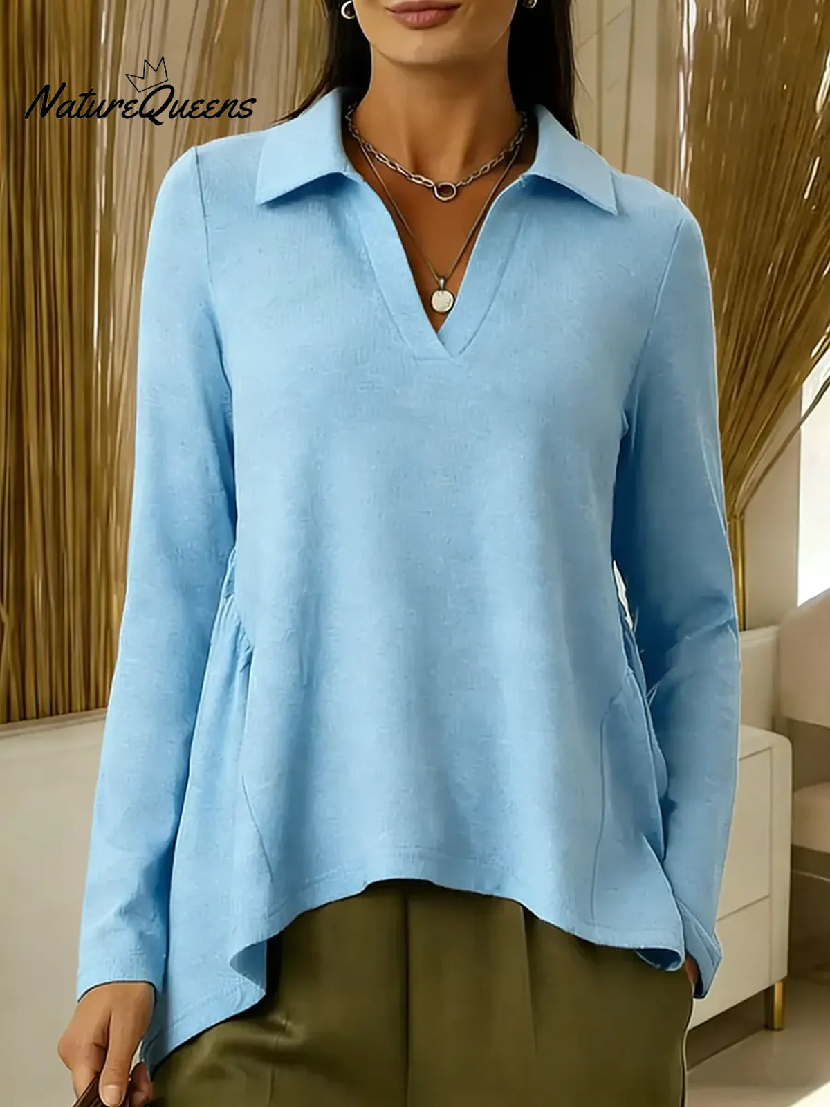 Women's Solid Color V-neck Long-sleeved Casual Loose-fitting Top With Irregular Hem.